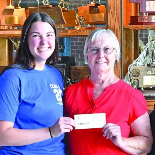 Class of 1976 representatives present Pierce High School Alumni Association representative Brynnlee Orwig (second from left) with a check. Left to right: 1976 class member Sue (Manzer) Bachman, Orwig, 1976 class member Rhonda (Reed) Peters, and 1976 class member Roberta (Warneke) Watts.