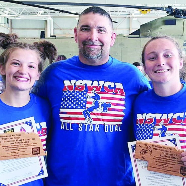 Pictured, left to right: Jayan Sackville, Pierce High Girls Wrestling Head Coach Les Painter, and Isabelle Kuehler. 